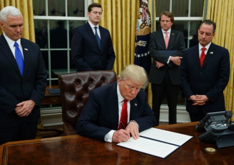 President Trump signs an EO formally withdrawing from the Trans-Partnership Agreement